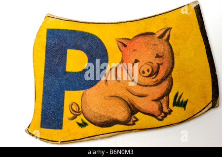 Vintage lettera alfabeto pezzo di puzzle per i bambini con la lettera L e la foto dei lecca lecca stampati su di essa Foto Stock