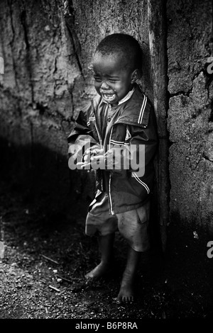 Masai Mara Kenya ritratto di un ragazzo di pianto Foto Stock