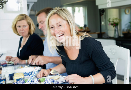 Donna felice e altri due Foto Stock