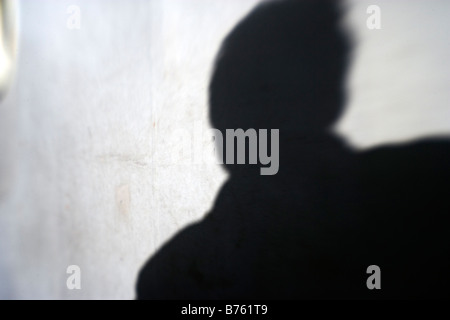 Ombra minacciosa di un uomo Foto Stock