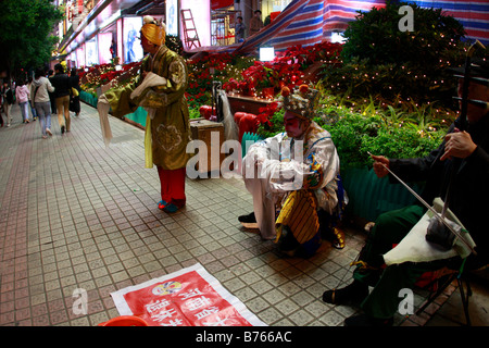 Elegante mendicanti cinese durante la crisi globale Foto Stock