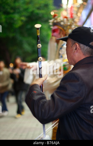 Elegante mendicanti cinese durante la crisi globale Foto Stock