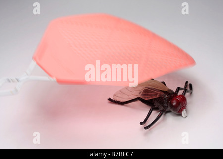 Swatting un big fly (falso) Foto Stock