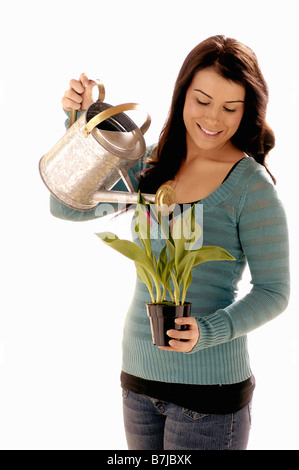 Ragazza giovane w/ annaffiatoio/Flower, Regina, Saskatchewan Foto Stock