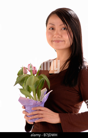 Asian giovane ragazza w/Flower, Regina, Saskatchewan Foto Stock