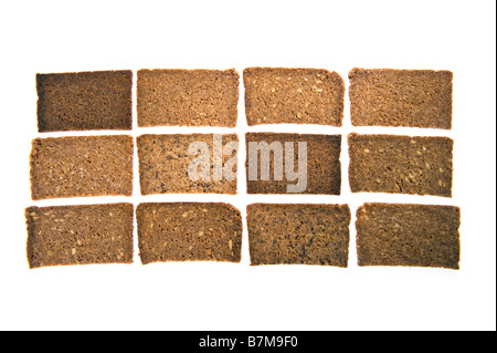 Fette di pane marrone vollkornbrot tedesco tutto il mais pane scuro chicco di mais derrata alimentare pane integrale di grano intero assortime Foto Stock