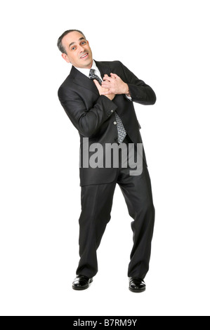 Businessman in a suit pretending to have a heart attack isolated on white background Foto Stock