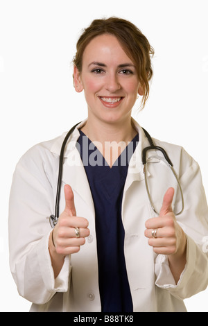 Medico dà due pollici in su Foto Stock