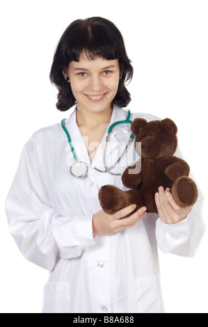 Bella ragazza medico con Teddy bear isolato su bianco Foto Stock