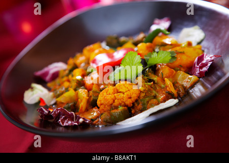 Il cavolfiore tikka masaala, dolce cotto con panna fresca e mite salsa tandoori. Foto Stock