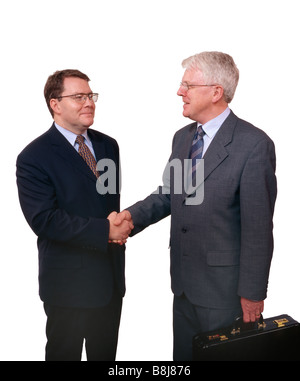 Due uomini di affari stringono le mani Foto Stock
