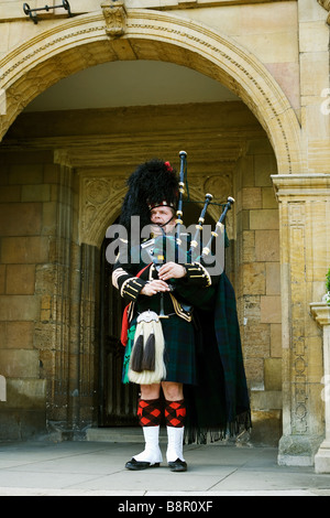 Scottish highland Piper Foto Stock