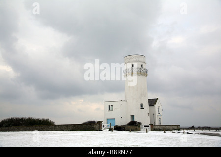 Faro nella neve Foto Stock