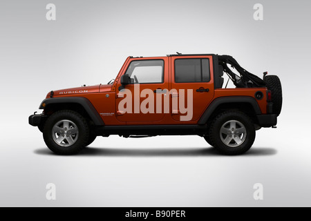 2009 Jeep Wrangler Unlimited Rubicon in arancione - Driver Profilo laterale Foto Stock