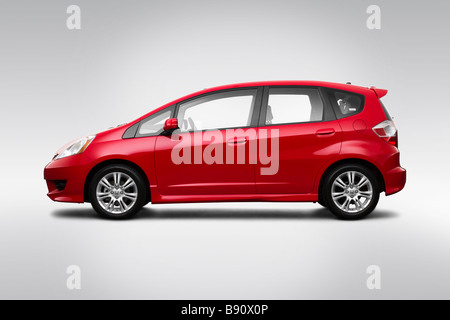 2009 Honda Fit Sport in rosso - Driver Profilo laterale Foto Stock