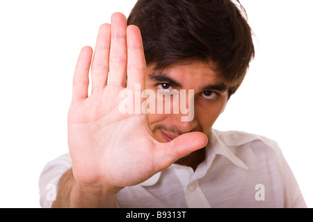 Giovane uomo gesticolando per fermare con la mano Foto Stock
