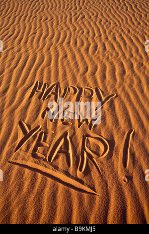 La Mauritania, Adrar, Felice Anno Nuovo scritto nella sabbia Foto Stock