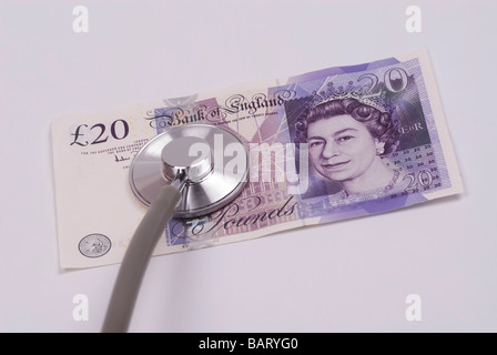 Uno stetoscopio sul monetario britannico Foto Stock