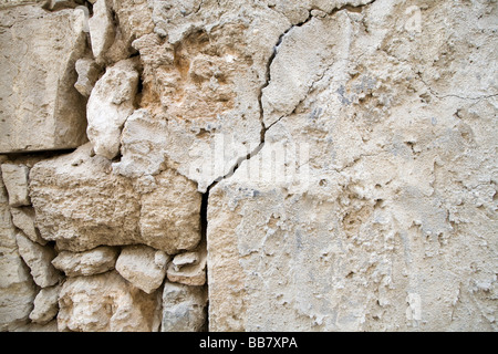 Close up incrinato intonaco e muratura in pietra Foto Stock