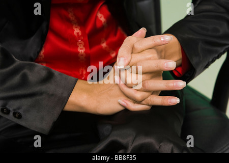 La donna nel suo lavoro-legati alla vita di tutti i giorni, la postura, il linguaggio del corpo Foto Stock