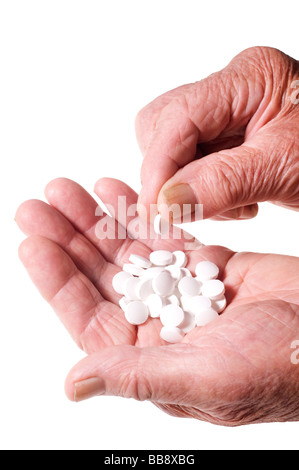 Senior mani pila di compresse Foto Stock