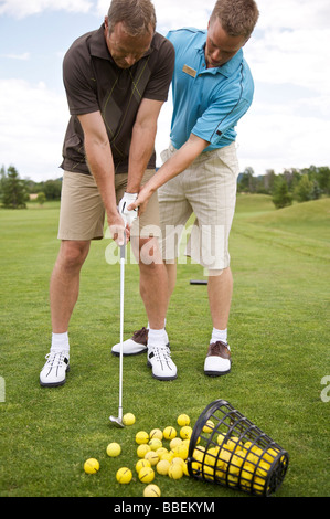 L'uomo ad apprendere come Golf, Burlington, Ontario, Canada Foto Stock