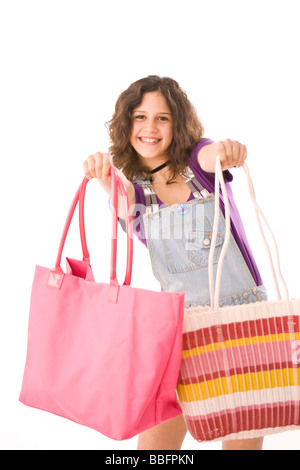 Ragazza sorridente con borse per lo shopping Foto Stock