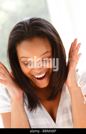 Overjoyed donna etnica Foto Stock