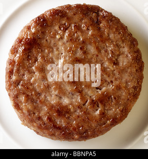 Beefburger su una piastra Foto Stock