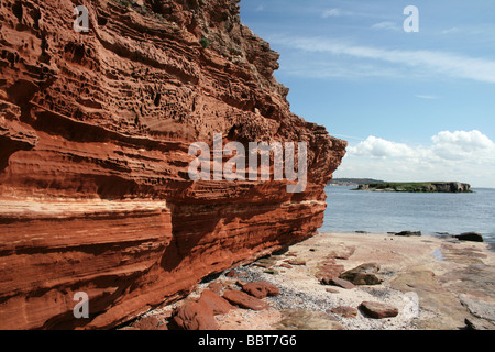 Bunter scogliera di arenaria su Hilbre Island, siti di particolare interesse scientifico, il Wirral, Merseyside, Regno Unito Foto Stock