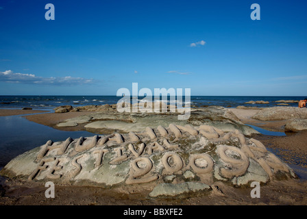 Spiaggia inciso rocce annunciando la 2009 Hua Hin Jazz festival Thailandia E.S. Asia Foto Stock