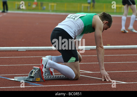 Runner in blocchi di partenza Foto Stock