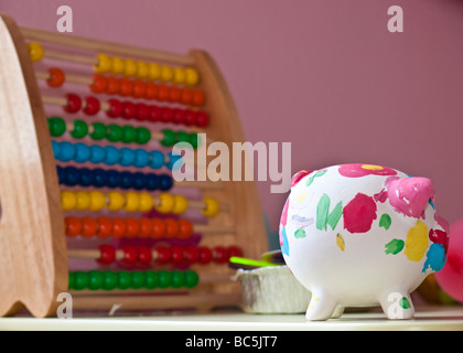 Salvadanaio e abacus Foto Stock