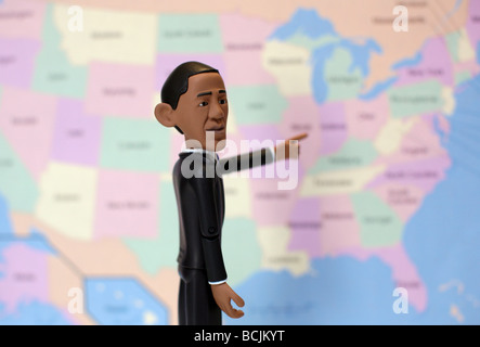 Barack Obama azione figura nella parte anteriore della mappa degli STATI UNITI D'AMERICA Foto Stock