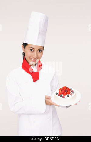 Allegro lady torta di contenimento Foto Stock