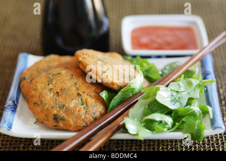 Torte tailandesi di pesce Foto Stock