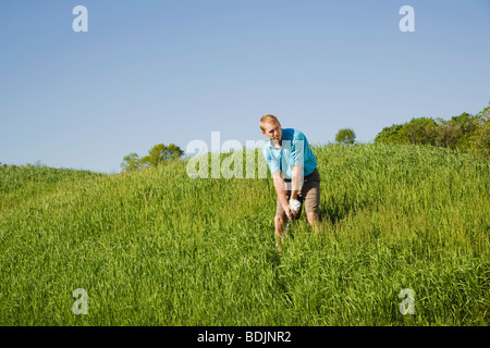 L'uomo giocando a golf Foto Stock