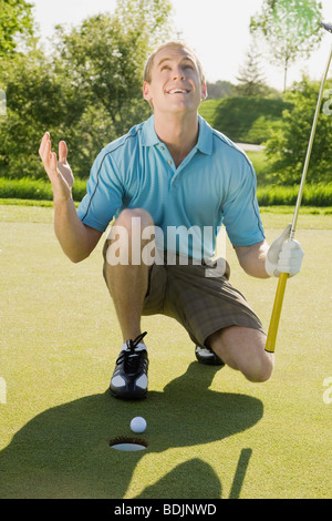 Frustrati golfista Foto Stock