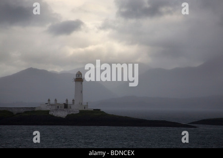 Robert Stevenson Lismore faro e della Scozia montagne più alte in tempesta da Oban a Craignure traghetto, Regno Unito. Foto Stock