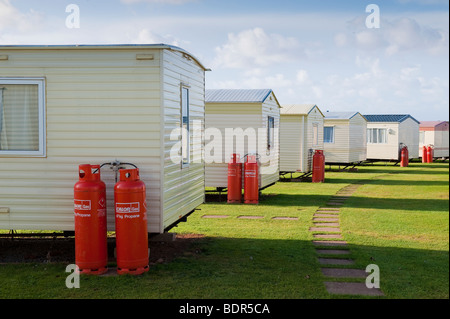 Caravan Park Vacanze home SITO A Doniford, Somerset con Calor Gas cilindri Foto Stock