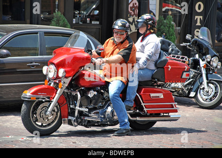 Matura in sella motocicletta Foto Stock