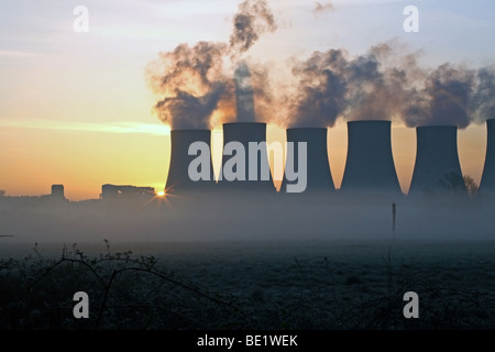 Sunrise over power station Foto Stock