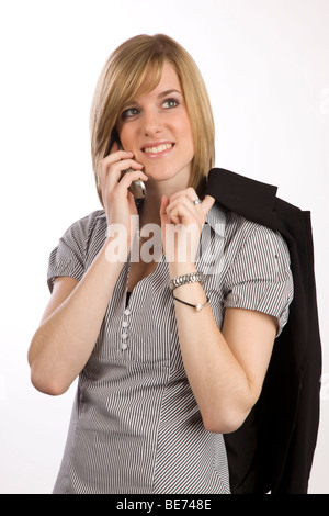 Giovane donna bionda con un telefono cellulare Foto Stock