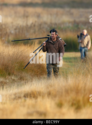 Fotografo in Richmond Park dopo cervi solchi Foto Stock