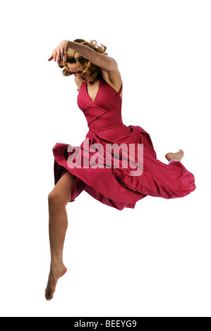 Giovane ballerina di eseguire contro uno sfondo bianco Foto Stock