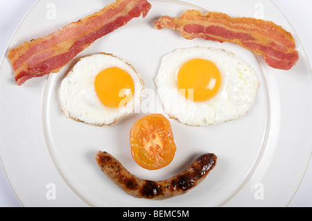 Prima colazione inglese tradizionale in forma di una faccia Foto Stock