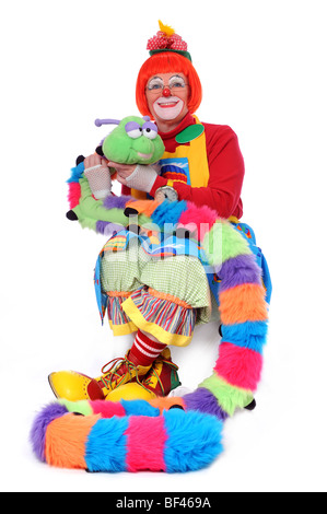 Clown colorati seduta con pet worm Foto Stock