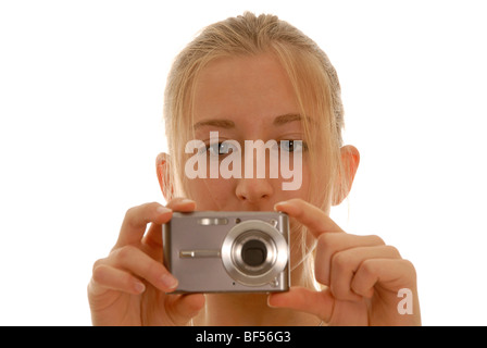 Diciotto anni di vecchia donna con una fotocamera digitale Foto Stock