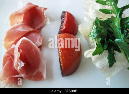 Prosciutto di Parma con pomodoro nell'aceto balsamico e insalata di Arucola (Ristorante l'o, Horgen CH) Foto Stock