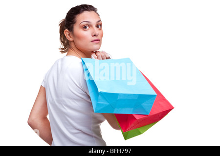 Giovane donna il trasporto delle borse della spesa Foto Stock